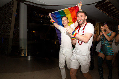 Olympic medalist and Pride Party at Sea Grand Marshal Adam Rippon celebrating Pride Month with Celebrity Cruises alongside both guests and crew on board the brand’s newest ship, Celebrity Edge.
