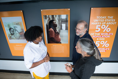 (From left) Artist Mary Baxter of Philadelphia, Pa. talks with Ben & Jerry's Co-Founder Jerry Greenfield and Sherry Packman of Starksboro, Vt., while viewing the newly-opened Art for Justice exhibit at the Ben & Jerry's factory on Tuesday, June 25, 2019 in Waterbury, Vt. The exhibit highlights the need for criminal justice reform and features artwork by formerly-incarcerated artists, including Baxter. (Andy Duback/AP Images for Ben & Jerry’s)