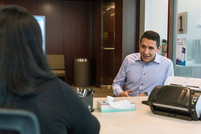 Patient coordinator registering Guillermo Muñoz Küster in the new space. (PRNewsfoto/Northwestern Memorial Hospital)