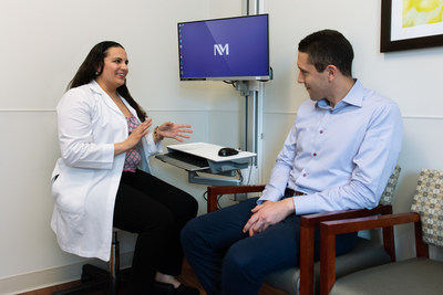 Guillermo Muñoz Küster meets with Lily Gutierrez and discusses his follow-up appointment in Spanish. Guitierrez is one of the nurses that speaks Spanish fluently. (PRNewsfoto/Northwestern Memorial Hospital)