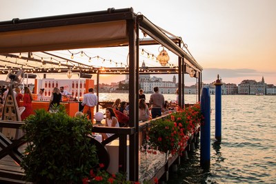 Aperol celebrates its 100th Birthday in Venice, bringing guests from around the world together to toast to the iconic orange aperitif (PRNewsfoto/Aperol)