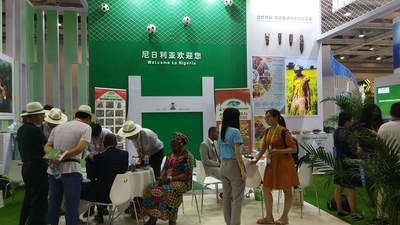 Chinese businessmen are engaging with the exhibitor at the Nigerias pavilion.