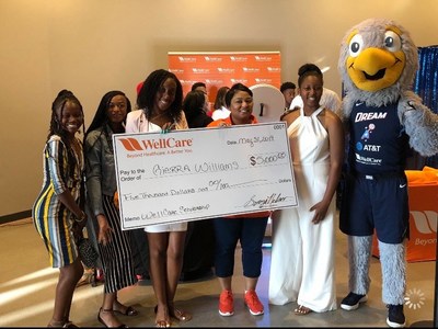 On June 1, Gierra Williams received a WellCare of Georgia Scholarship during an Atlanta Dream WNBA game.