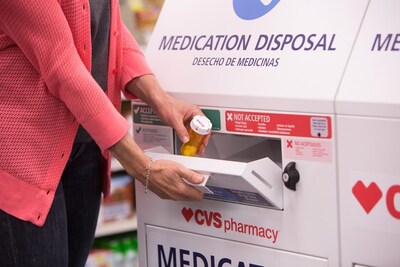 A customer disposes of unwanted prescription drugs at a CVS Pharmacy in-store safe medication disposal unit. A customer disposes of unwanted prescription drugs at a CVS Pharmacy in-store safe medication disposal unit.