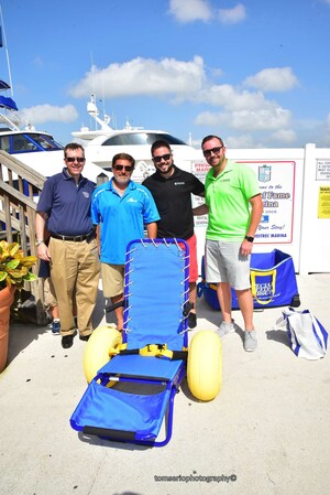 Special Needs Group Donates a $2,000 Joy on the Beach (JoB) Wheelchair and Wheeled Carry Bag to Dive4Vets Organization at Hall of Fame Marina's National Marina Day Celebration