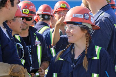 Trades workers at Seaspan Victoria Shipyards gather to mark the ceremony of the shipyard’s new contract to maintain the five Halifax-class frigates for the Royal Canadian Navy based on the West Coast. (CNW Group/Seaspan Shipyards)