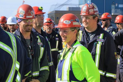 Trades workers at Seaspan Victoria Shipyards gather to mark the ceremony of the shipyard’s new contract to maintain the five Halifax-class frigates for the Royal Canadian Navy based on the West Coast. (CNW Group/Seaspan Shipyards)