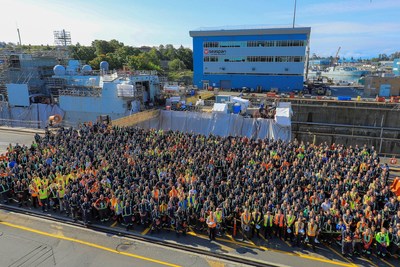 Over 1,000 trades workers at Seaspan Victoria Shipyards gather in front of the HMCS Vancouver to mark the ceremony of the shipyard’s new contract to maintain the five Halifax-class frigates for the Royal Canadian Navy based on the West Coast. (CNW Group/Seaspan Shipyards)