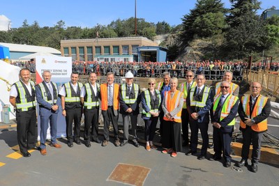 The Honourable Carla Qualtrough, Minister of Public Services and Procurement and Accessibility (centre) and Joe O’Rourke, Vice President and General Manager, Seaspan Victoria Shipyards (fifth from left) with other officials, gather after the announcement of a new contract for the shipyard to maintain the Royal Canadian Navy’s fleet of Halifax-class frigates based on the West Coast. (CNW Group/Seaspan Shipyards)