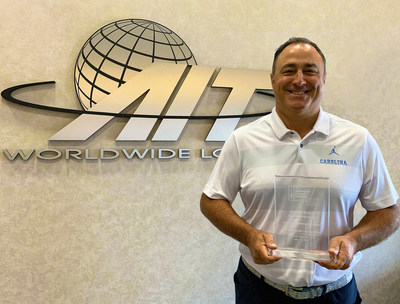 AIT Worldwide Logistics' President and CEO, Vaughn Moore, with the American Cancer Society's Chicago Select Corporate Partnership Award