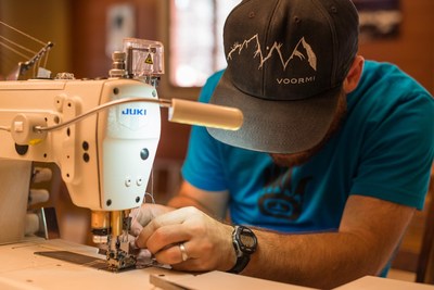 A worker sewing at apparel manufacturer VOORMI in Pagosa Springs, Colo., one of the projects featured in the 2019 NMTC Progress Report