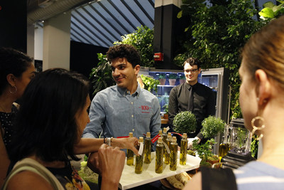 Guests transform fresh herbs and spices into compound butter and infused oils in New York City, Thursday, July 18, 2019. (Clarence Sormin)
