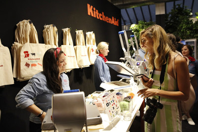 Guests decorate tote bags with unique patches that represent who they are in the kitchen from the KitchenAid Culinary Playground in New York City, Thursday, July 18, 2019. (Clarence Sormin)