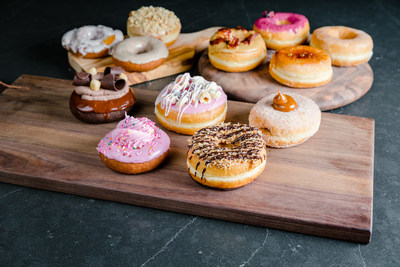 Twelve new Dream Donuts will be available at Tim Hortons 130 King, including maple bacon, crème brûlée, hazelnut buttercream, blueberry hibiscus, Dulce de Leche, Froot Loops™ and more. (CNW Group/Tim Hortons)