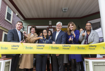 Liberty Mutual Insurance CEO David Long is joined by Boston Mayor Marty Walsh, Bridge Over Troubled Waters President Elisabeth Jackson and Liberty Mutual Foundation President Melissa MacDonnell at the ribbon-cutting for the 10-bedroom Liberty House, dedicated to providing a home for youth and young adults who are experiencing homelessness.