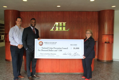 Pictured: American Income Life-Altig/Orlovic Director of Operations Nate Schoot and Director of Public Relations Andrew Haskins with Ann Harkins, President and CEO of the National Crime Prevention Council.