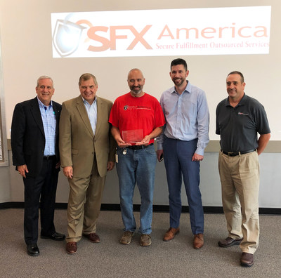 Canon Solutions America President, Peter Kowalczuk, (2nd from left) presented SFX America with a plaque to commemorate the milestone of the 5000th imagePRESS installation. Also in photo L to R: Mark Gill, Sr. Director Regional Sales, Canon Solutions America; from SFX America - Earl Grant, Production Manager, John Stevens, COO, and Shawn Humphrey, General Manager.
