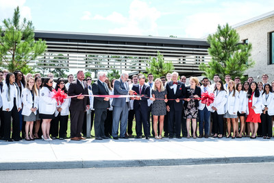 Flanked by medical students, PCOM President and CEO Jay Feldstein, DO, and Georgia Governor Brian Kemp with First Lady Marty Kemp and PCOM Board Chair John Kearney, lead the ribbon cutting which marks the opening of PCOM South Georgia, the first four year medical school in Southwest Georgia. Flanked by medical students, PCOM President and CEO Jay Feldstein, DO, and Georgia Governor Brian Kemp with First Lady Marty Kemp and PCOM Board Chair John Kearney, lead the ribbon cutting which marks the opening of PCOM South Georgia, the first four year medical school in Southwest Georgia.