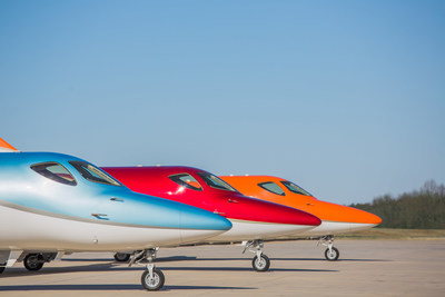 The HondaJet Elite in Ice Blue, Ruby Red and Monarch Orange at Honda Aircraft Company's headquarters in Greensboro, NC.