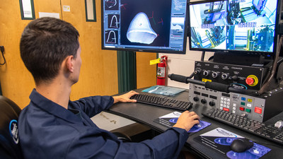 An Auburn University researcher studies a 3-D rendering of scans produced by a state-of-the-art $1.5 million X-Ray CT system recently acquired through a grant from the National Institute of Standards and Technology. An Auburn University researcher studies a 3-D rendering of scans produced by a state-of-the-art $1.5 million X-Ray CT system recently acquired through a grant from the National Institute of Standards and Technology.