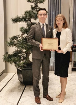 Simon Wang, Executive Assistant Manager, Niccolo Chengdu, is presented with the President's Appreciation Award by Dr Jennifer Cronin, President, Wharf Hotels, on Thursday 8 August 2019 in Chengdu.