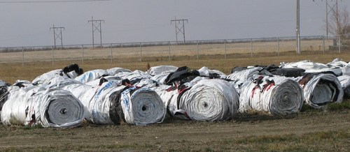 Rolled grain bags at a Saskatchewan Cleanfarms collection site ready to go to an end market to be washed, shredded and pelletized, and then recycled into new plastic bags. (CNW Group/CleanFARMS Inc.)