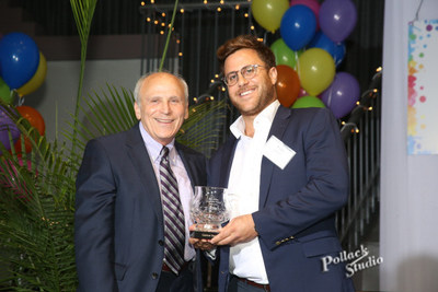 Todd Leebow, CEO and President of Majestic Steel USA receiving the Sam Miller Goodness Award given by Ron Kahn, Founder of Ronald McDonald House of Cleveland.