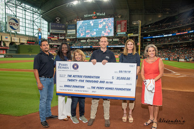 Perry Homes CEO, Kathy Britton (2nd from right) along with Perry Homes employees present Astros Foundation with $25,000 Gift. Astros Foundation Executive Director, Twila Carter, accepts (far right). (Photo credit www.AlexandersPortraits.com)