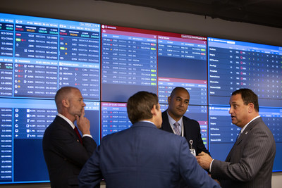 From left, Jeff Terry, CEO of Clinical Command Centers, Peter Chang M.D., vice president of care transitions at Tampa General Hospital, and Gov. Ron DeSantis listen as John Couris, president and CEO of Tampa General Hospital, speaks during a tour of Tampa General Hospital&rsquo;s new CareComm Command Center on Aug.20, 2019. In partnership with GE Healthcare, TGH's CareComm uses predictive analytics and artificial intelligence to display data in a mission control-like command center.