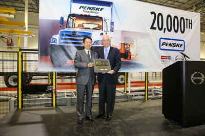 Yoshio Shimo President of Hino Motors Limited presents the commemorative 20000th truck key to Roger Penske.