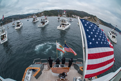 In the waters just off Avalon Harbor, the 18 participating yachts of the Second Annual War Heroes on Water Sportfishing Tournament gather around the host yacht, Bad Company 144, for the presentation of the American flag by the LAPD Color Guard ahead of the Tournament's shotgun start.