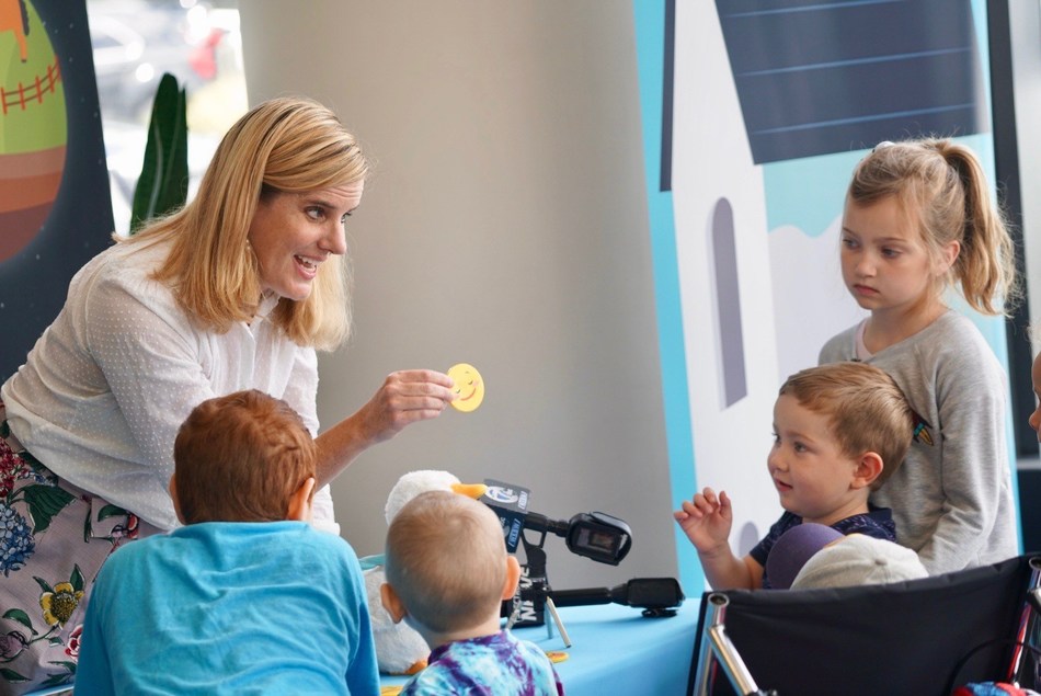 Aflac Senior Manager of Corporate Social Responsibility Buffy Swinehart demonstrates My Special Aflac Duck for children at the Roswell Park Comprehensive Cancer Center in Buffalo, New York on Aug. 23, 2019.