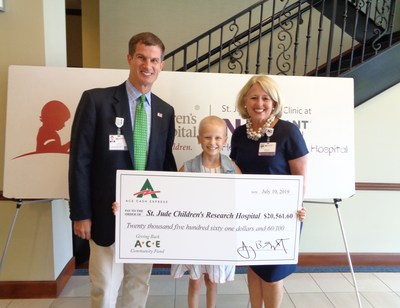 A St. Jude patient accepts a donation from Affiliate Clinic’s staff on behalf of ACE Cash Express
