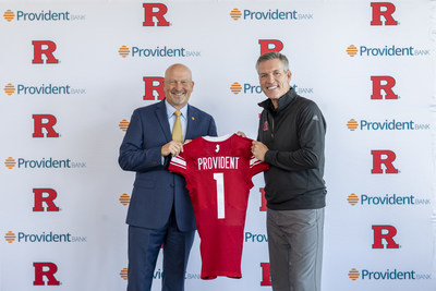 Pat Hobbs, Director of Intercollegiate Athletics, Rutgers University (Right), presents Chris Martin, Chairman, President, and CEO, Provident Bank with a Rutgers football jersey to commemorate the two organizations' partnership.