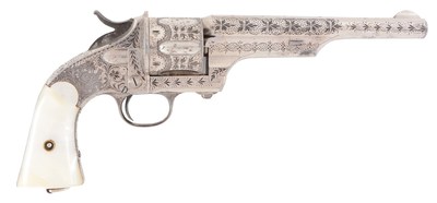 Exquisite factory-engraved Merwin & Hulbert 2nd Model open-top .44 single-action cartridge revolver, 1873 serial number. Estimate $6,000-$9,000