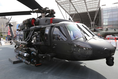An S-70i Black Hawk helicopter at the MSPO trade show carries a lightweight single-station external stores pylon supporting four Hellfire air-to-ground missiles. The prototype pylon’s drop design offers a wide field of fire to the crew-served machine gun, which also can be locked into a fixed forward position for control by a pilot gunner.