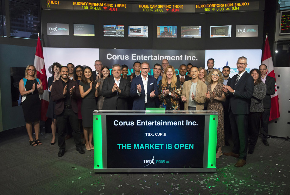 Corus President & CEO Doug Murphy joined by Heather Shaw, Executive Chair and John Gossling, EVP and Chief Financial Officer alongside Corus representatives including ET Canadas Carlos Bustamante, as the company celebrates 20 years as a listed company on the Toronto Stock Exchange. (CNW Group/Corus Entertainment Inc.)