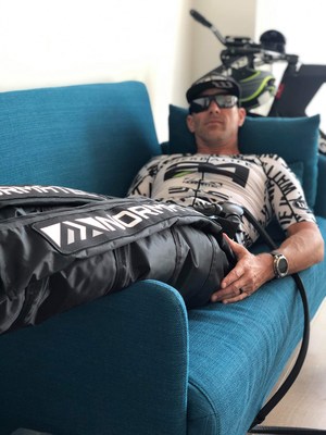 Wattie Ink. athlete Marc Nester recovering with NormaTec. Photo by Doris Nester.