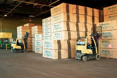 Forklift operators at Georgia-Pacific&rsquo;s Gurdon, Ark., plywood operation lift strap-wrapped 90-sheet bundles of finished plywood sheathing for transport to building and lumber stores across the country.  GP today announced a two-year $70 million upgrade to the plant in southern Arkansas, bringing to $100+ million its investment in plywood and lumber operations there in the past five years.
