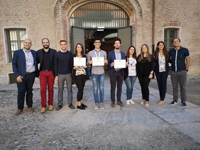 The 2019 Reaxys SCI Award winners (center) Denise Sighel (2nd Prize), Gianluigi Albano (1st Prize) and Marco Carlotti (3rd Prize) pictured with current and past members of the SCI Young Group and Elsevier representatives. (PRNewsfoto/Elsevier)
