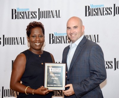 The mobile communications unit of C Spire, a diversified telecommunications and technology services company, has been selected as the best in Mississippi by readers of the Mississippi Business Journal, the state’s largest business publication. Above, Associate Publisher Tami Jones (left) presents reader's choice top award to Jason Thomas, senior manager of wireless sales operations for C Spire, at a Thursday morning awards program.