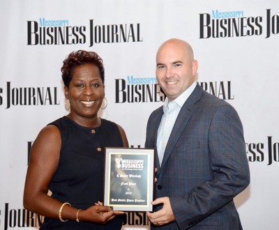 The mobile communications unit of C Spire, a diversified telecommunications and technology services company, has been selected as the best in Mississippi by readers of the Mississippi Business Journal, the state’s largest business publication.  Above, Associate Publisher Tami Jones (left) presents reader's choice top award to Jason Thomas, senior manager of wireless sales operations for C Spire, at a Thursday morning awards program.