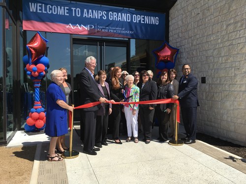 AANP's leadership team, including president Sophia L. Thomas, CEO David Hebert, and past president Joyce Knestrick pose for a picture with Loretta Ford (center) and others before cutting the inaugural ribbon at the grand opening event on Friday.