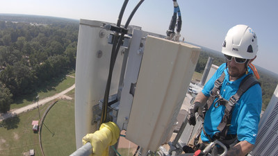 A worker updates wireless equipment on a C Spire cell site near Waynesboro, Mississippi, earlier this month. Customers are experiencing a 15 to 20 percent improvement in mobile broadband speeds throughout much of C Spire’s wireless network – thanks to installation of new base stations and software that will serve as the foundation for the company’s transition to the next generation of cellular technology.