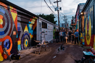 Spectators interact with artists as they create new works of public art during Denver, Colorado's CRUSH WALLS, an international urban art festival. (Credit: Nikki A Rae Photography)