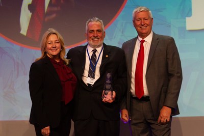 Jim Ullmann, National Air Traffic Controllers Association&rsquo;s director of safety and technology, receives the 2019 Air Traffic Controller of the Year award, presented by Rachel Jackson, Raytheon executive technical director, and Jack McAuley, Raytheon air traffic systems director.