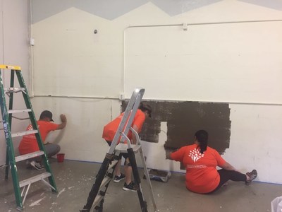 'Ohana Health Plan volunteers paint a teen room at the Boys & Girls Club.