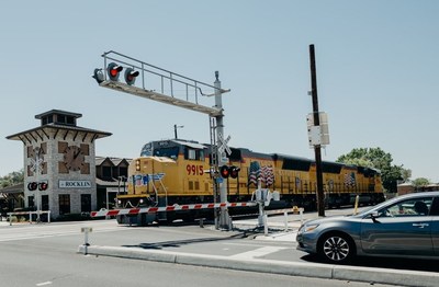 A driver stops as railroad signals activate for an approaching train in Rocklin, California. Union Pacific's Rail Safety Week efforts will raise awareness about the importance of safely crossing train tracks.