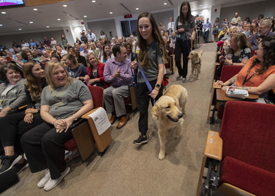 St. Jude Paws at Play hospital dogs Puggle, a Golden Retriever, and Huckleberry, a Golden Doodle, meet their fellow St. Jude employees at a Town Hall. St. Jude Paws at Play hospital dogs Puggle, a Golden Retriever, and Huckleberry, a Golden Doodle, meet their fellow St. Jude employees at a Town Hall.