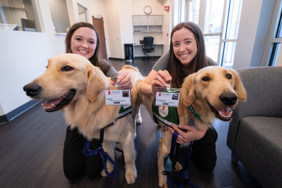 As the newest St. Jude employees, Puggle (left) and Huckleberry received their ID badges during orientation. They are accompanied in this photograph by their respective primary handlers, Child Life specialists Brittany Reed and Shandra Taylor. As the newest St. Jude employees, Puggle (left) and Huckleberry received their ID badges during orientation. They are accompanied in this photograph by their respective primary handlers, Child Life specialists Brittany Reed and Shandra Taylor.